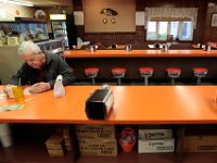 1008020024 ma nb MasDonuts  Edmond Larocque who has been coming to Ma's Donuts on Acushnet Avenue in the north end of New Bedford, for over 30 years, enjoys a donut and coffee.   PETER PEREIRA : food, restaurant, eat, morning, breakfast, work, labor